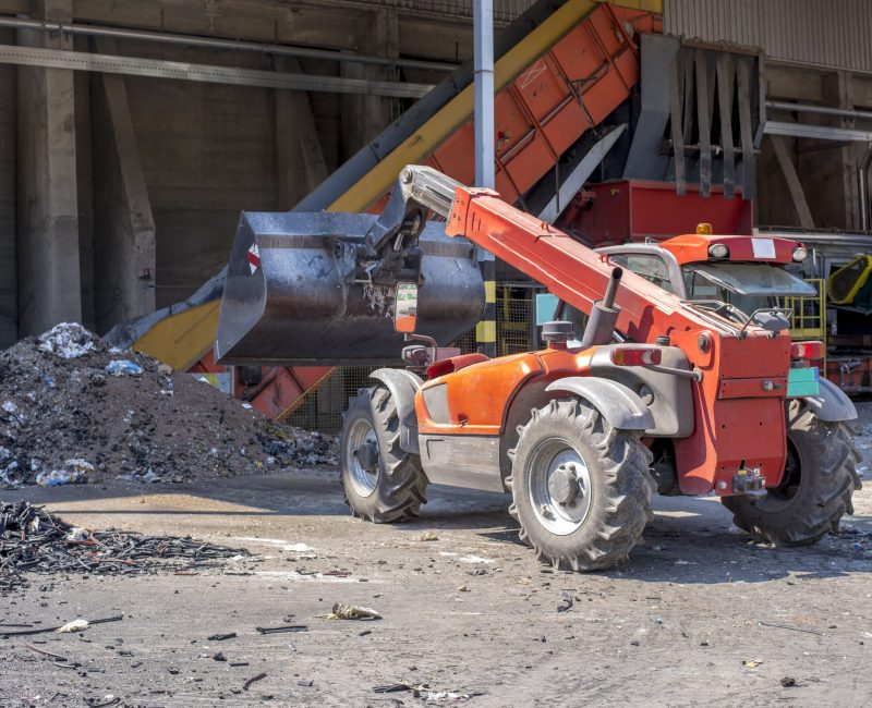 loader-transporting-soil-waste-materials-waste-treatment-plant-scaled-1.jpg